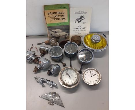 A collection of vintage Smiths car clocks light and mascots 