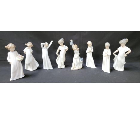 EIGHT NAO GIRL FIGURINESin night gowns, including girl with lantern and dog, 21cm high (8)