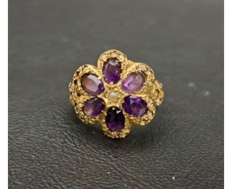 AMETHYST AND SEED PEARL CLUSTER DRESS RINGthe six oval cut amethysts surrounded by seed pearls, on nine carat gold shank, rin