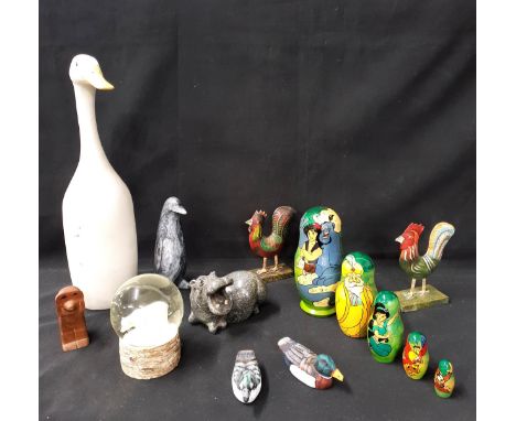 ASSORTMENT OF DECORATIVE ITEMS including five Disney Aladdin nesting eggs, pottery goose, 43cm high; polar bear snow globe, t