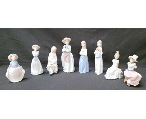 EIGHT NAO GIRL FIGURINESincluding girls with puppies, school girl and chalkboard, girl in pink hat, tallest 24cm high (8)