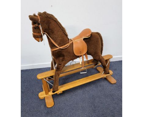 MAMAS AND PAPAS 'ROCKING HORSE COLLECTION' BROWN ROCKING HORSEwith leather bridle and saddle, held on a light wooden trestle 