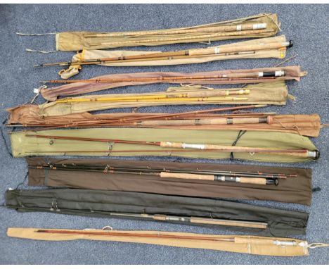 NINE ASSORTED VINTAGE FISHING RODSconsisting of Sharpes of Aberdeen 'Scotty' impregnated cane two piece rod  in canvas case, 