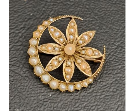 SEED PEARL CRESCENT AND FLOWER BROOCH/PENDANTin unmarked gold, 2.2cm wide and approximately 3 grams