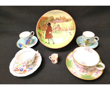 SELECTION OF MIXED DECORATIVE CERAMICSincluding four cups and saucers decorated with hand painted birds on a pale blue ground
