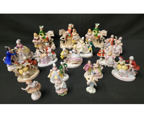 LARGE SELETION OF CONTINENTAL CERAMIC FIGURE ORNAMENTSmost depicting a a man and a woman in various repose, some with one fig
