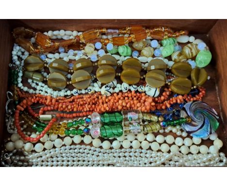 SELECTION OF TWELVE VINTAGE NECKLACESincluding a triple strand pearl necklace with silver claps, another pearl necklace, vari