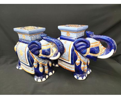 PAIR OF VINTAGE GLAZED CERAMIC ELEPHANT PLANT STANDSdecorated in pale blue, brown and white on a midnight blue ground, both 4