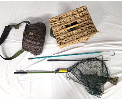 TWO FISHING TACKLE BASKETSwith two fishing nets and a large quantity of old canvas fishing cases etc