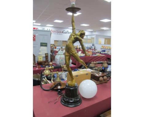 Art Deco Gilt Painted Spelter Table Lamp, as a dancing scantily clad maiden, her right arm held aloft the light, with white g