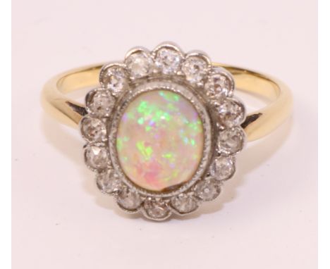 Opal and diamond cluster gold ring   Condition Report   Click here for further images, condition, auction times & delivery co