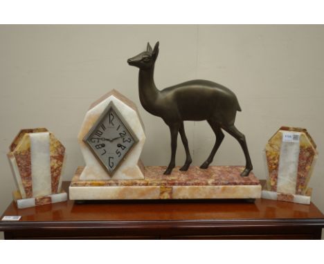 Art Deco coloured marble clock garniture, clock with lozenge dial signed Libault, Angers with a model of a deer, and with two