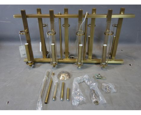 A R V Astley 'Louis' eight light chandelier, with tubular glass shades (one missing), with original tags, H.48.5 W.90 D.25cm 