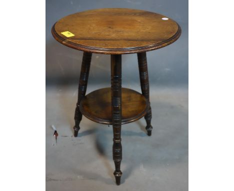 An Arts &amp; Crafts circular mahogany lamp table, H.46 D.35cm 