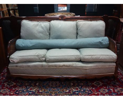 An early 20th century Queen Anne style mahogany bergere sofa, H.82 W.150 D.72cm 