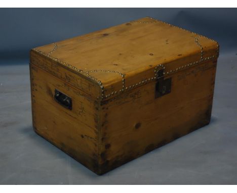 An antique pine trunk, stud bound, H.34 W.56 D.38cm 