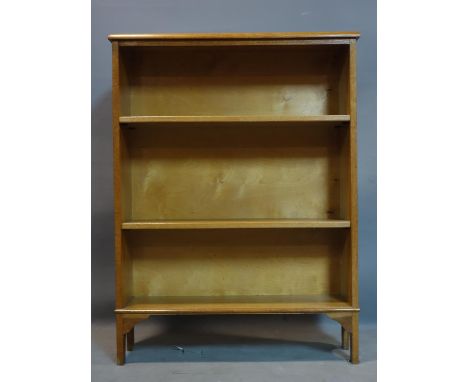 A light oak open bookcase, bearing Harrods label, raised on bracket feet, H.102 W.76 D.21cm 