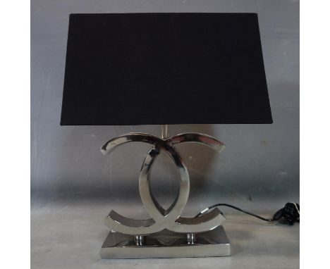 A Chanel style chrome table lamp with black shade, H.55cm 