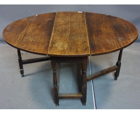 An 18th/19th century oak gate leg drop leaf dining table, with end drawer, H.70 W.138 D.104cm 