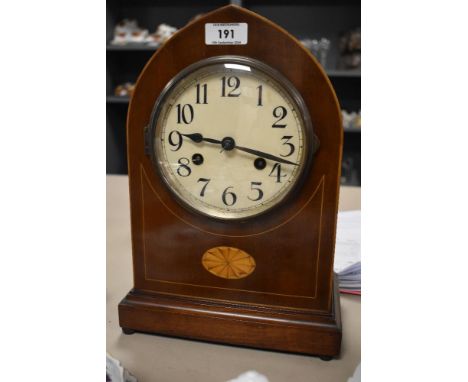 An Edwardian mahogany lancet top mantel clock, having pendulum.