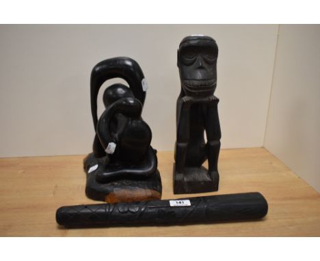 Two carved  African blackwood figures sold along with a blackwood truncheon having shamrock design.