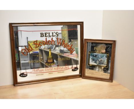 A vintage Bells Old Scotch Whisky advertising mirror, 55cm sold along with a 'Ford' reproduction advertising style mirror 32c
