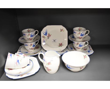 A Shelley bone china 'Bluebird' pattern six setting tea set, comprising six cups, six saucers, six side plates, sugar and cre
