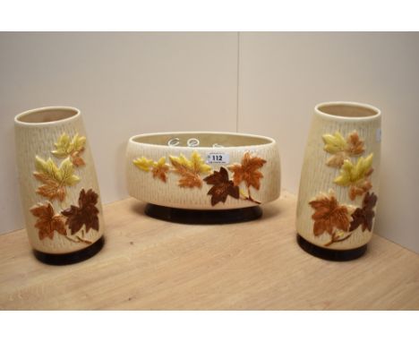 Three 1960s Sylvac Autumn Leaves patterned vases, to include a pair of cylindrical tapering vases measuring 21cm high