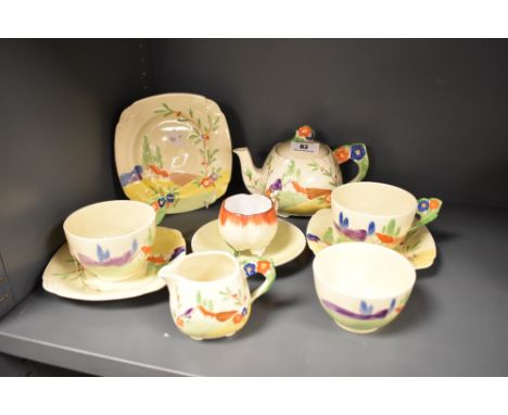 A Grindley Art Deco part tea set, comprising tea pot, two tea cups and saucers, sugar, cream and side plate, each decorated i