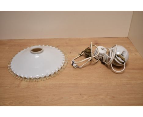A 20th century white ceramic pendant light fitting with egg shaped adjustment pulley and crimped opaque glass shade with clea
