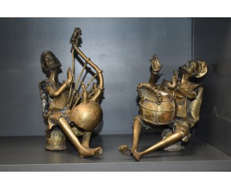 A pair of Nigerian (Benin) brass musician figures, one seated the other modelled playing a harp type instrument both with app