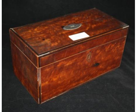 A tea caddy and contents