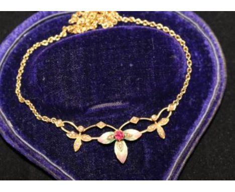 An Edwardian 15ct gold, ruby, seed pearl and enamel pendant necklace, of foliate design, 16in.