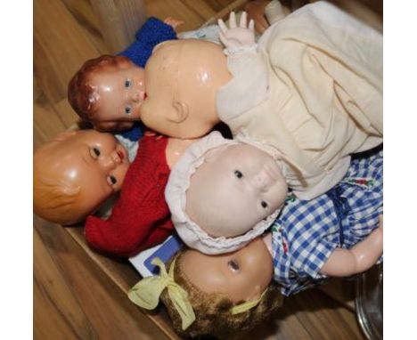 A collection of various Rosebud, Pedigree, Tudor Rose and other dolls, vintage doll's hospital items and two toy pandas