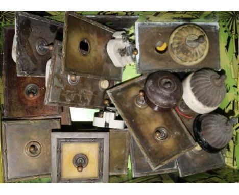 A collection of 1920s-30s light switches