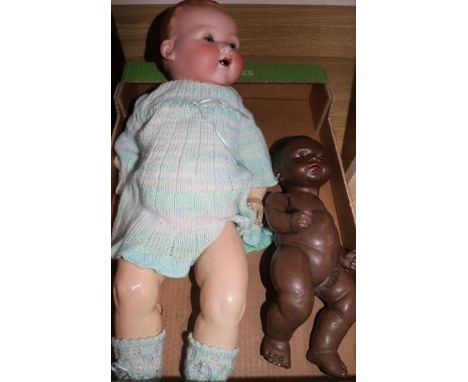 A. M 351.70K, open mouthed baby doll and a Heubach 414.2/0 D.r.g. M. black baby doll