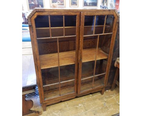 1930's oak astragal-glazed bookcase with three shelves, on block tapering supports, 79cm wide 