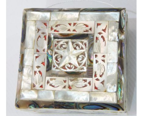 Mother-of-pearl trinket box, square with hinged lid, having openwork star and foliate design, on bun feet, 7.5cm wide 