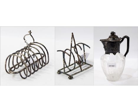 EPNS-mounted glass claret jug with floral etching, EPNS toastrack and another spelling out the word "toast", on bun feet (one