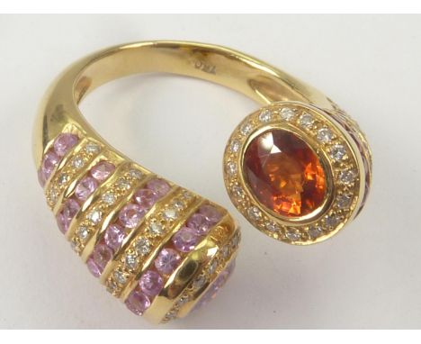 Dress ring with crossover of hessonite garnet and pink tourmaline in 18ct gold. Size 'M' (variable). 