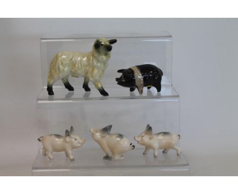 Three Beswick figures: Piglet - running, no. 833, 4cm high and two x Piglet - trotting, no. 834, 4cm high (one with ear a.f.)