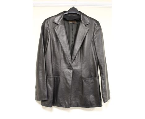 Loewe lady's black leather jacket with single button fastening and horizontal pockets. 