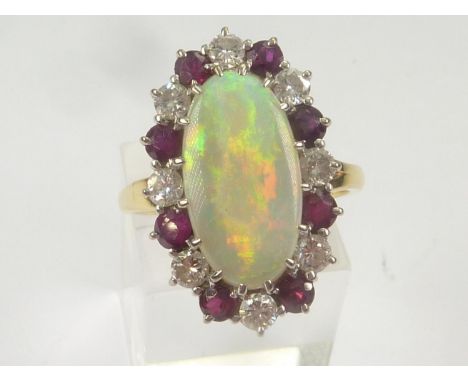 Cluster ring with oval opal surrounded by diamonds and rubies alternating, 18ct gold. Size 'P'.&nbsp; 