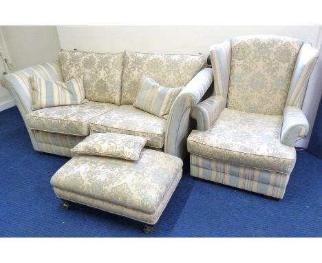 Modern two seat Knoll sofa and a similar wing chair and rectangular stool. 