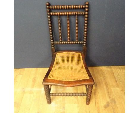 Oak bobbin turned cane seated chair. 