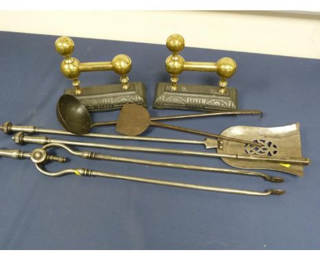 Three piece fireside companion set, brass on cast iron fire dogs, blacksmith made ladle and scraper. (7). 