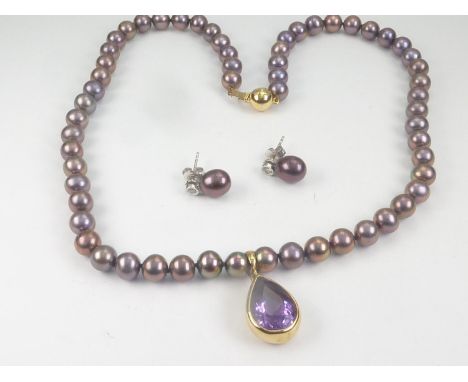 Single row necklace of stained cultured pearls with amethyst drop in 18ct gold, also a pair of ear studs, each with a diamond