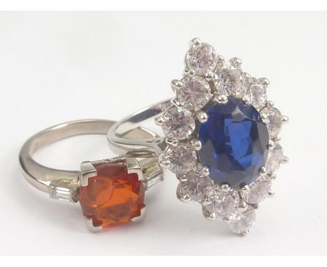 Fire opal and diamond ring in white gold, probably 9ct and a paste sapphire cluster ring, 9ct white gold. (2). Sizes 'K' &amp