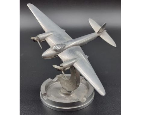 An aluminium model of a&nbsp;de Havilland Mosquito, the ashtray base stamped '82 SQD SEAC 46', base 18cm high, (s.d.).