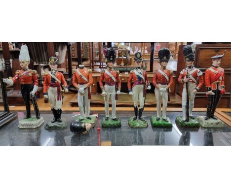 A matched set of eight porcelain military figures, to include: a Royal Worcester 'Coldstream Guard Field Order 1815', 26.5cm 